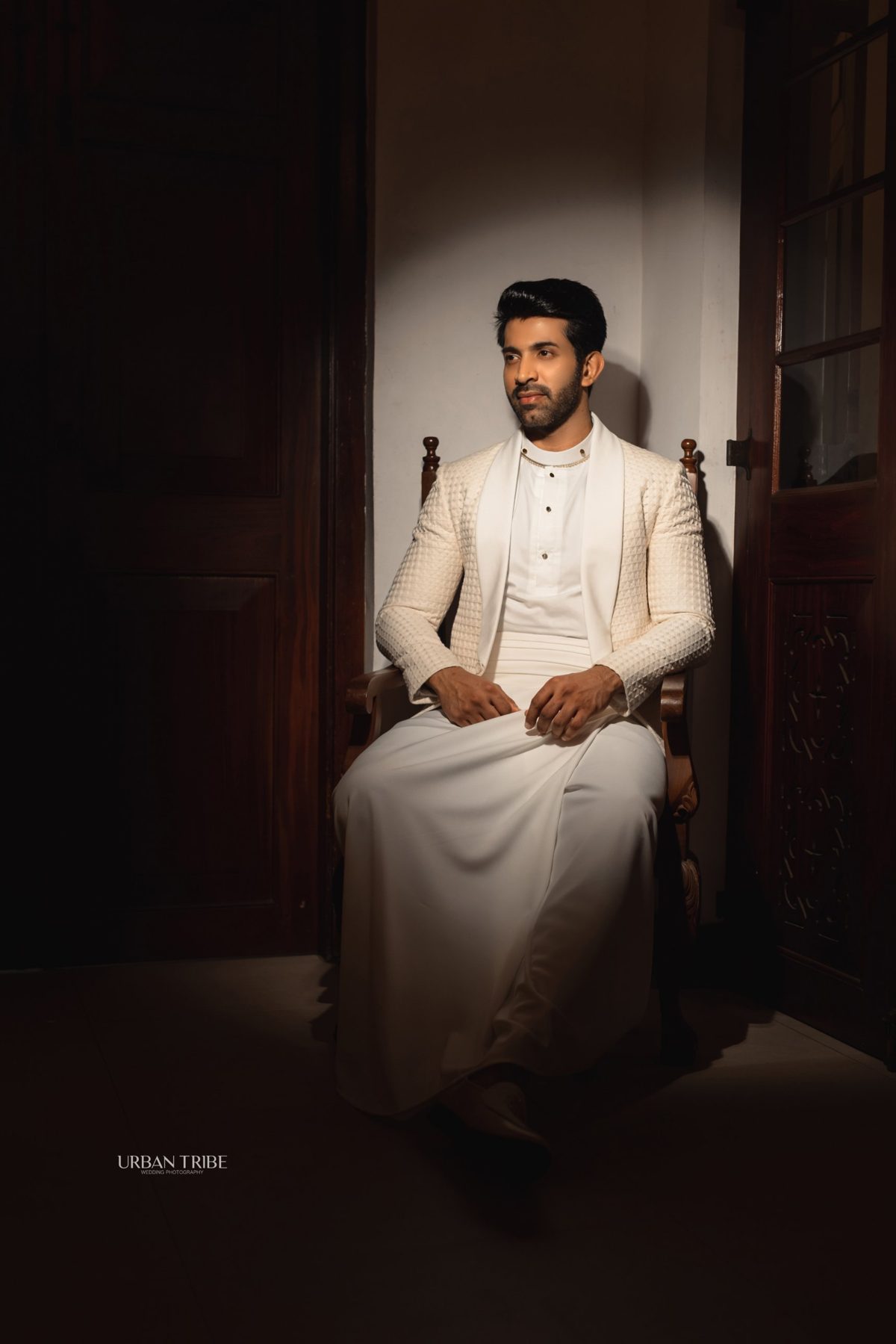 Groom in an ivory Aarya Sinhala outfit with a textured jacket